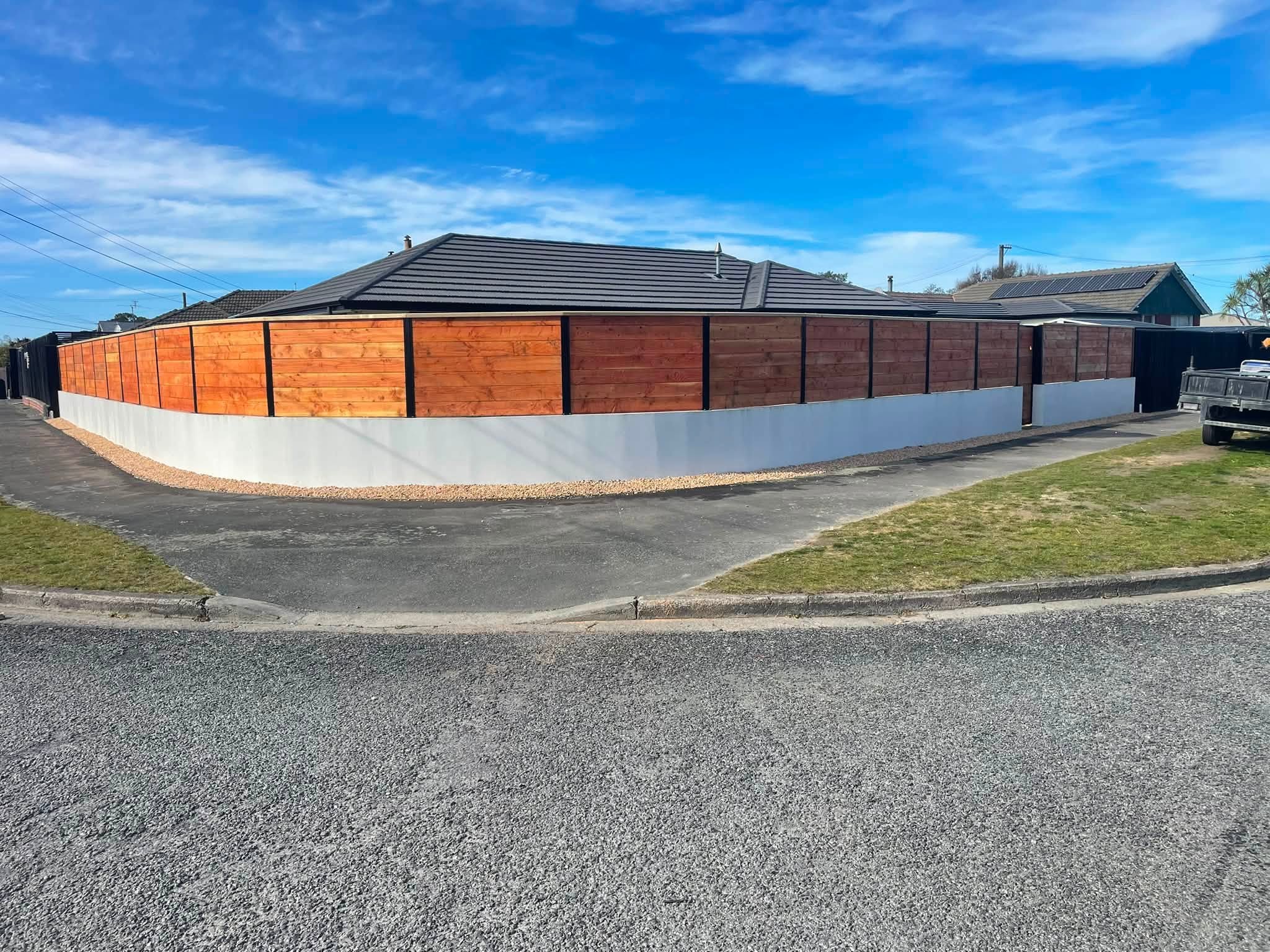Timber boundary fence and matching gate by Wolf Fencing